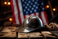 Dirty work hard hat on a wooden table against the background of the American flag. AI generation Royalty Free Stock Photo