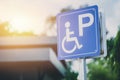 Disability car parking sign to reserved space for handicap driver Royalty Free Stock Photo