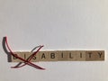 Creative Concept : the word Disability in wooden letters