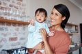 Disability, mother and baby with down syndrome in a happy and lovely family home with childcare on the weekend. Mom and Royalty Free Stock Photo