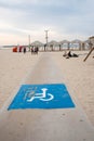 Disability sign and path road for wheel chair on the sea beach. beach places for people with disabilities Royalty Free Stock Photo