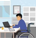Handicapped businessman sitting on wheelchair and using computer in office. Royalty Free Stock Photo