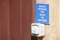 Disabled accessible push button buzzer for assistance sign at shop entrance Royalty Free Stock Photo