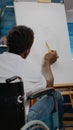 Disabled african american artist working on drawing