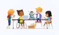 Disabled African American girl in wheelchair and other children standing around desk with laptops and robot and working