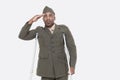 Disabled African American military officer in uniform salutes over gray background