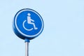 Disabled Badge Holders Only at Car Park Sign Post in Blank Blue Sky Royalty Free Stock Photo