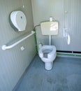 Disabled bathroom with the special water closet Royalty Free Stock Photo