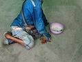 Disabled beggar sit on floor for begging