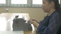 Disabled blind person woman using vintage braille typewriter a simple machine used to write Braille character encoding for visual