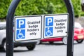 Disabled blue badge holder parking sign for driver Royalty Free Stock Photo