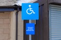 Disabled blue badge holder parking sign for driver Royalty Free Stock Photo