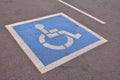 Disabled parking sign painted on asphalt. Royalty Free Stock Photo