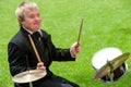 Disabled boy playing drums.