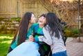 Disabled boy in wheelchair laughing with teen sister on patio Royalty Free Stock Photo