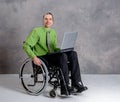 Disabled business man in wheelchair with computer Royalty Free Stock Photo