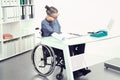 Disabled business man in wheelchair is sorrowful Royalty Free Stock Photo