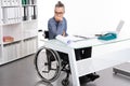 Disabled business man in wheelchair is sorrowful Royalty Free Stock Photo