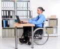 Disabled business man in wheelchair working with computer Royalty Free Stock Photo