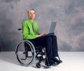 Disabled business man in wheelchair with computer Royalty Free Stock Photo