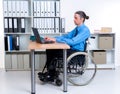 Disabled business man in wheelchair working with computer Royalty Free Stock Photo
