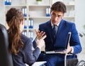 Disabled businessman having discussion with female colleague Royalty Free Stock Photo