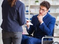 Disabled businessman having discussion with female colleague Royalty Free Stock Photo