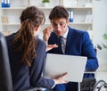 Disabled businessman having discussion with female colleague Royalty Free Stock Photo