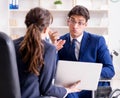 Disabled businessman having discussion with female colleague Royalty Free Stock Photo