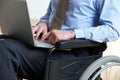 Disabled Businessman In Wheelchair Using Laptop Royalty Free Stock Photo