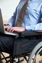 Disabled Businessman In Wheelchair Using Laptop Royalty Free Stock Photo