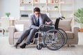 Dsabled businessman on wheelchair working home Royalty Free Stock Photo