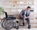 Dsabled businessman on wheelchair working home Royalty Free Stock Photo