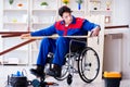 The disabled carpenter taking measurement in workshop