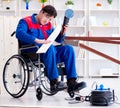 Disabled carpenter working with tools in workshop Royalty Free Stock Photo