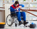 Disabled carpenter working with tools in workshop Royalty Free Stock Photo