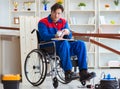 Disabled carpenter working with tools in workshop Royalty Free Stock Photo