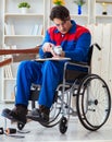 Disabled carpenter working with tools in workshop Royalty Free Stock Photo