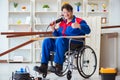 The disabled carpenter working with tools in workshop Royalty Free Stock Photo