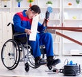 Disabled carpenter working with tools in workshop Royalty Free Stock Photo