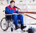 Disabled carpenter working with tools in workshop Royalty Free Stock Photo