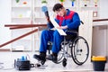 The disabled carpenter working with tools in workshop Royalty Free Stock Photo