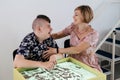 disabled child doing sensory activity with sand, rehabilitation