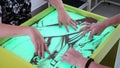 disabled child doing sensory activity with sand, rehabilitation