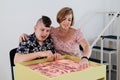 disabled child doing sensory activity with sand, rehabilitation