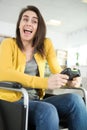 disabled female playing video game Royalty Free Stock Photo