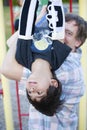 Disabled five year old boy on the monkey bars Royalty Free Stock Photo