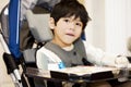 Disabled four year old boy studying