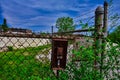 Disabled gate button at Abandoned factory building with broken windows in lake mills WI