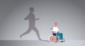 Disabled guy on wheelchair dreaming about recovery shadow of healthy man running imagination aspiration concept male